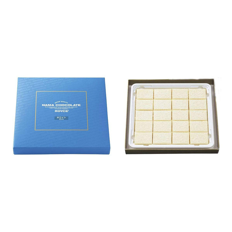 ROYCE' Chocolate - Nama Chocolate White - Image shows a blue box on left with white text inside golden square saying ROYCE' Quality Nama Chocolate By breaking down old customs and producing consistently original items, we are pursuing a new level in chocolate enjoyment. ROYCE' White. Box on right shows white blocks of chocolates.