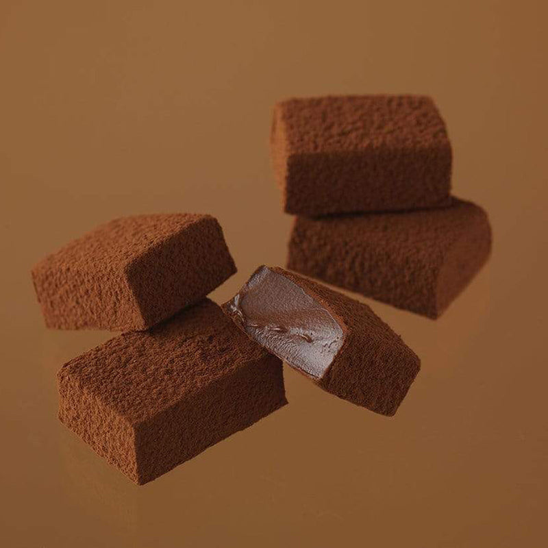 ROYCE' Chocolate - Nama Chocolate Mild Cacao - Image shows brown blocks of chocolates with a brown background.