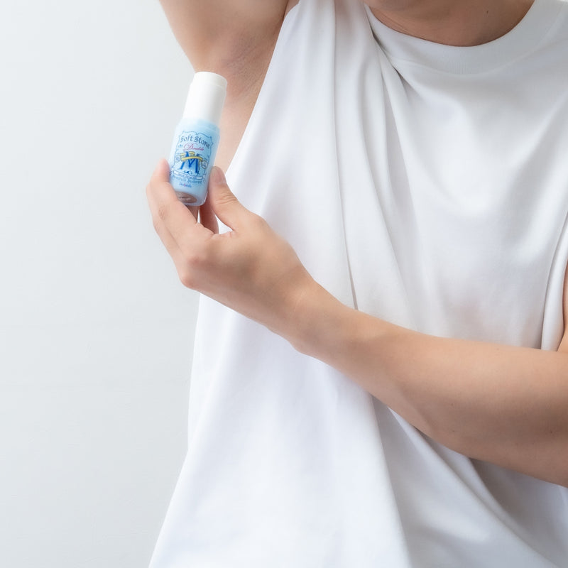 Applying Men Soft Stone W to the underarm