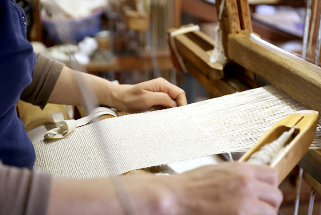 Hand weaving Kibiso silk body wash towels in the workshop